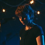 On-stage portrait of Michaela Gilchrist of Victrix performing.