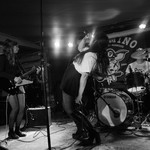 Action shot of Brass Lip performing on the Palomino stage.