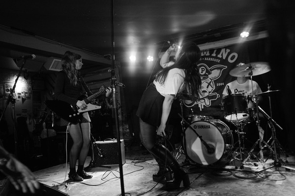 Action shot of Brass Lip performing on the Palomino stage.