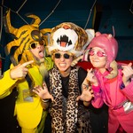 Portrait of eccentric group Peelander-Z making silly faces toward the camera.