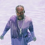Taken from above, solo artist BAWAH (previously MAUVEY) is submerged, while draped in traditional African cloth.