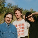 Outdoor photo of trio Bluffing, taken in a prairie setting.