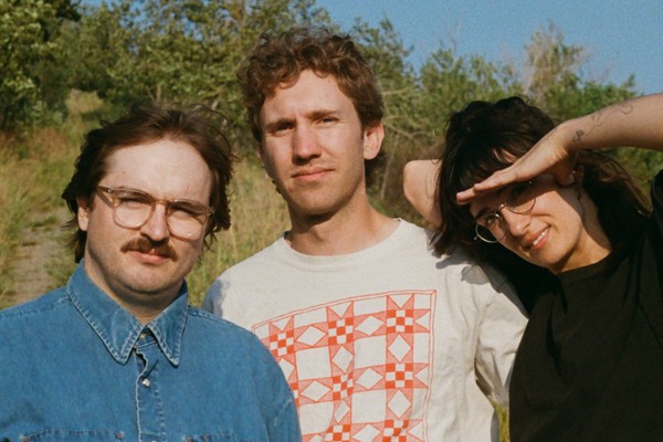 Outdoor photo of trio Bluffing, taken in a prairie setting.