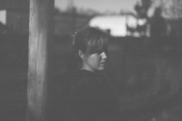 Black and white outdoor photo of Clea Anaïs