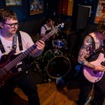 Three-piece band tarotfuntime are seen playing live at Pinbar in a colour photo.