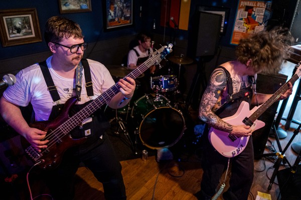 Three-piece band tarotfuntime are seen playing live at Pinbar in a colour photo.