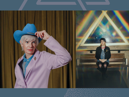 A colour photo shows artist Rae Spoon in a pink blazer tipping a blue cowboy hat on the left, and artist Cassia Hardy on the right sitting on a wood bench with light projections of multiple triangles behind them.