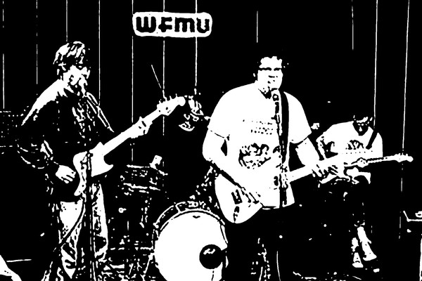 Black and white photo of Tha Retail Simps performing on stage