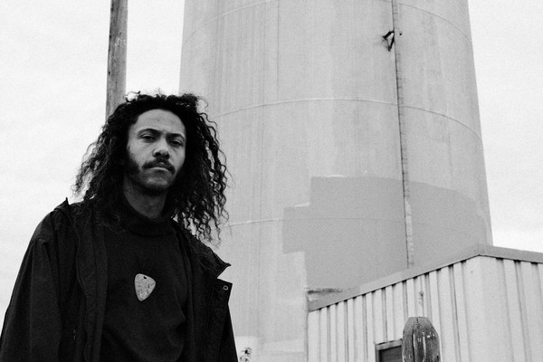 Black and white photo of solo musician Jairus Sharif