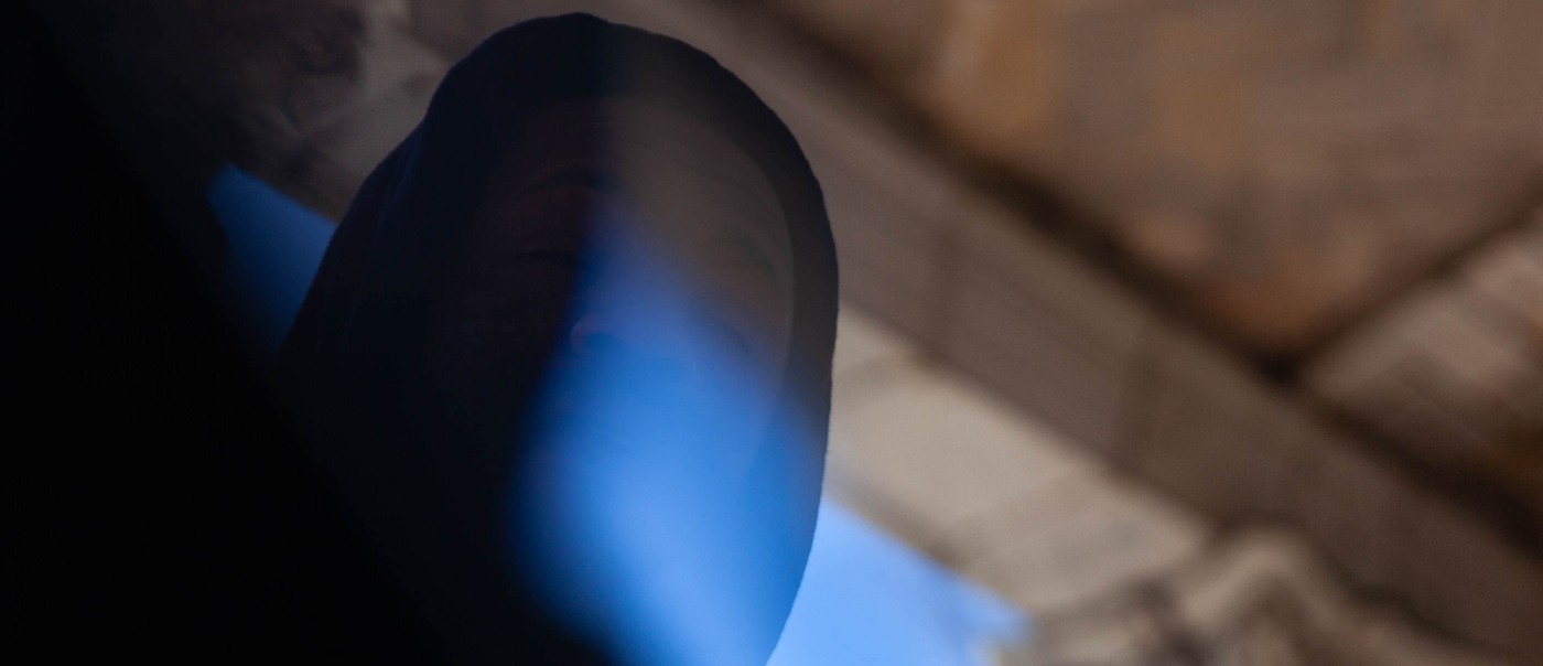 Hazy photo of rapper billy woods, shot from below.