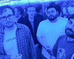 A photo bathed in blue light shows four-piece Horse Rider standing in a mirrored room and you can see various reflections of the band behind them. 